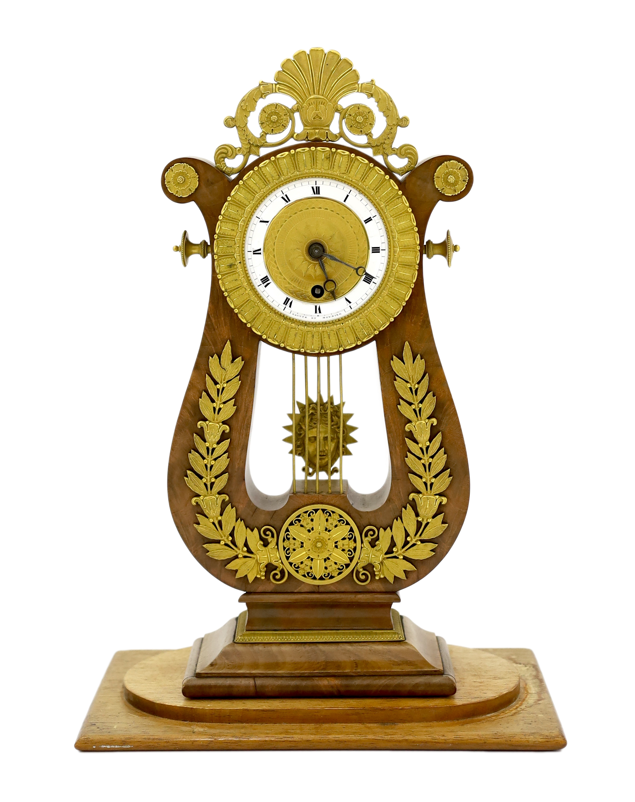 Bautte et Moynier. An early 19th century Swiss ormolu mounted mahogany lyre shaped mantel timepiece